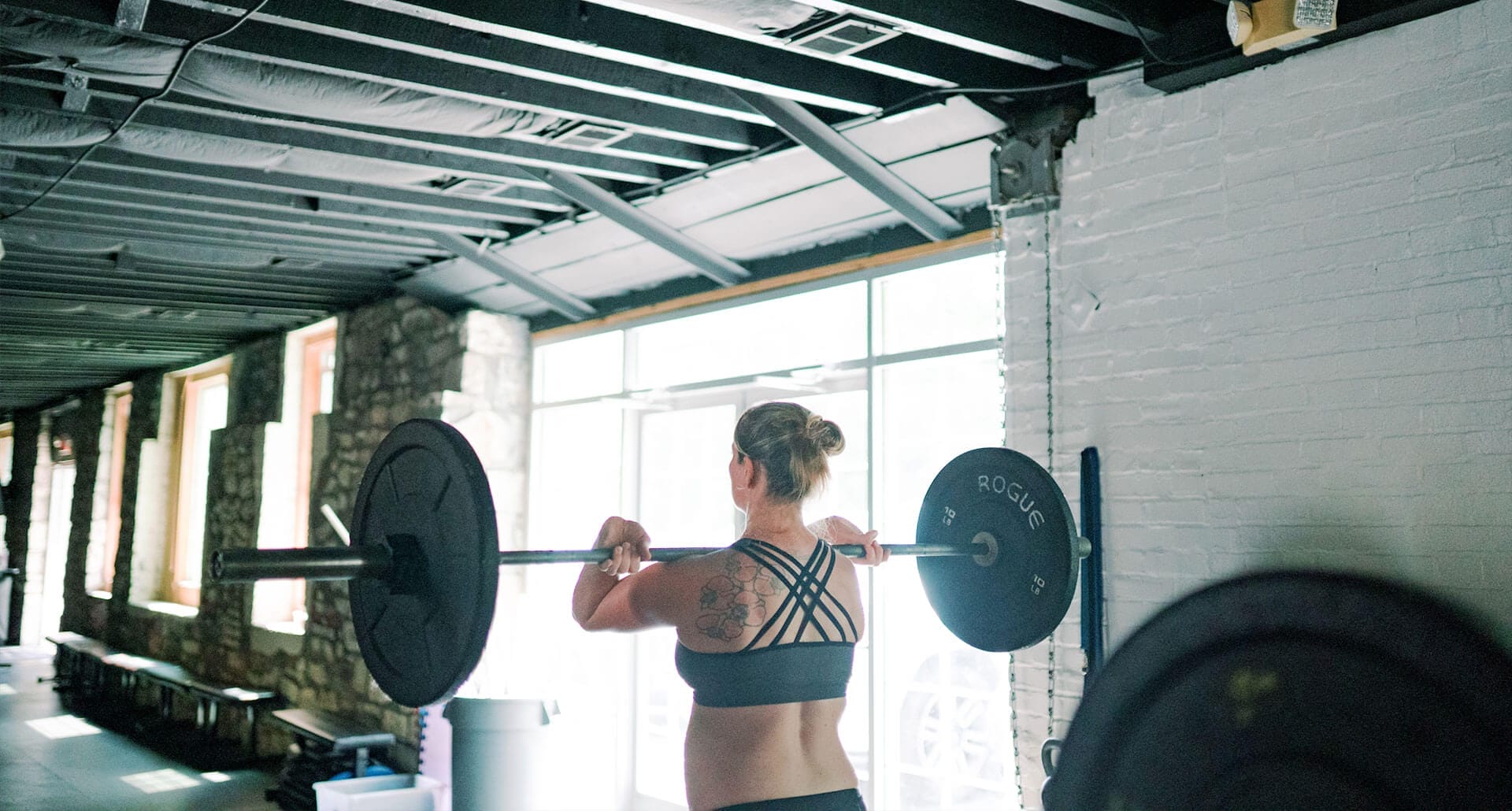 woman-lifting-weights Woman lifting in our gym
