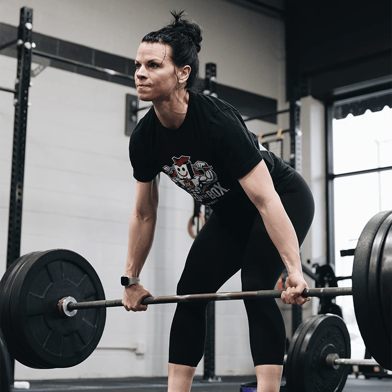 woman lifting weights at Whole Strength